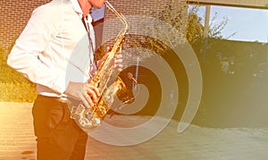 Golden Blues. Boys Band saxophone section at event , jazz player male playing on Saxophone, music instrument played by man saxopho