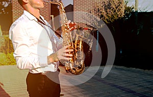 Golden Blues. Boys Band saxophone section at event , jazz player male playing on Saxophone, music instrument played by man saxopho