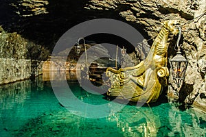 Golden boat in an underground lake