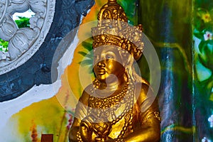 Golden Bodhisattva Statue On The Worship Altar Inside Room Of Buddhist Temple