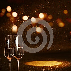 Golden bokeh background with champagne and light spot