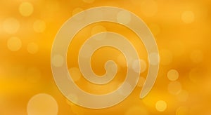 Golden bokeh background soft glowing light circles. Holiday golden bokeh sparkle background. photo