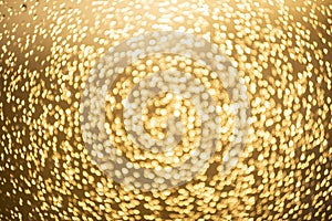 Golden bokeh defocused glitter, abstract background with yellow hot bokeh