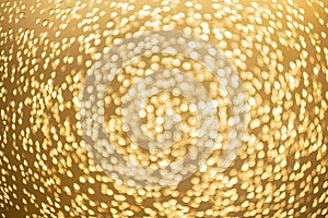 Golden bokeh defocused glitter, abstract background with yellow hot bokeh