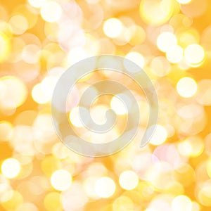 Golden bokeh effect background for Christmas and new year greetings or wishes, soft luxury gold background