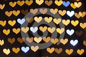 Golden bokeh hearts background