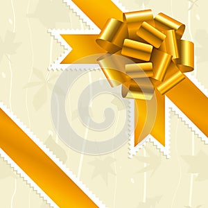Golden bow and ribbon over textured soft background