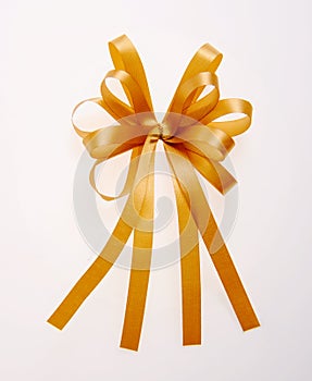 Golden bows with long ribbon