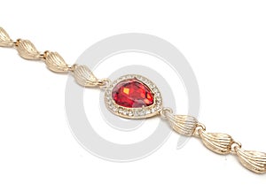 Golden bracelet with ruby and diamonds isolated on white