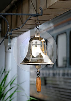 Golden brass bell at train station, Thailand