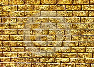 Golden brick wall texture background. photo