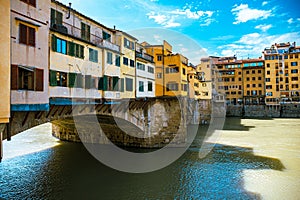 Golden bridge across Arno river in Florence