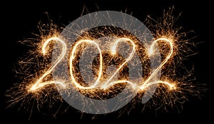 Golden bright modern sparkler number 2022 isolated black. happy new year eve silvester celebration background