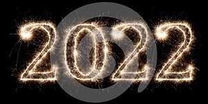 Golden bright sparkler number 2022 isolated  black. happy new year eve celebration background