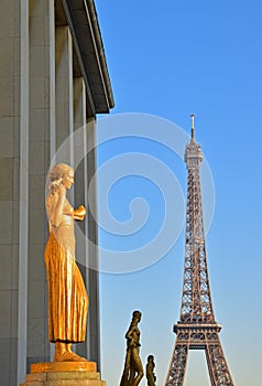 Golden and Bronze Statues in a row on Trocadero Square with Eiffel tower in the background, Paris, France