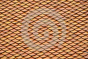 Golden brown glazed Asian antique roof tiling