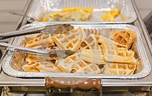 Golden Brown Waffles in an Aluminum Foil Tray