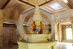 Golden Buddha in the Buddhist temple Brahma Vihara Arama, Bali, Indonesia. Yellow Buddha look beautiful