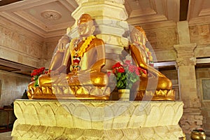 Golden Buddha in the Buddhist temple Brahma Vihara Arama, Bali, Indonesia. Yellow Buddha look beautiful