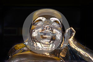 Golden Buddha in cloister of Thien Mu Pagoda, Hue City, Vietnam