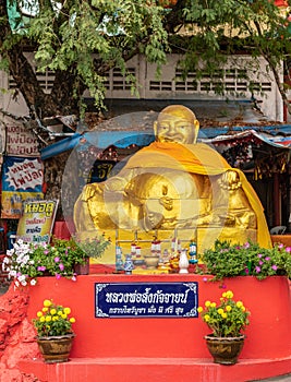 Golden Buddha down from Wat Koh Loy shrines on Ko Loi Island, Si Racha, Thailand
