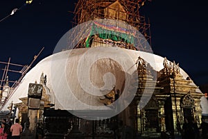 Golden buddha eyes on the white pagoda of Swayambhunath during Night sky. Buddhist stupa near Pashupatinath temple in Kathmandu.