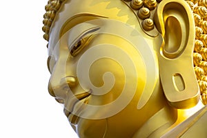 The golden Buddha face against a white background.