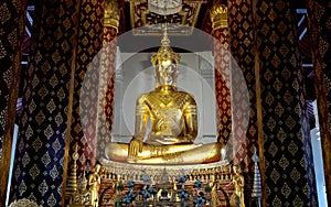 A golden buddha image in ancient temple in Ayutthaya