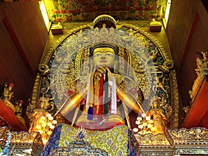 Golden Buddha image at Boudhanath stupa in Kathmandu, Nepal