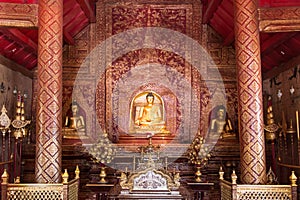 Golden Buddha image inside a temple in Thailand