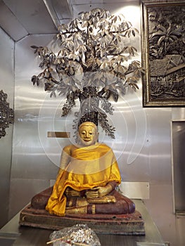 Golden Buddha image inside Wat Muen San temple, Chiang Mai silver temple