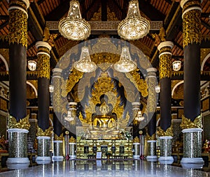 The golden buddha image within Wat Phra That Doi Phra Chan in Lampang