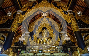 The golden buddha image within Wat Phra That Doi Phra Chan in Lampang