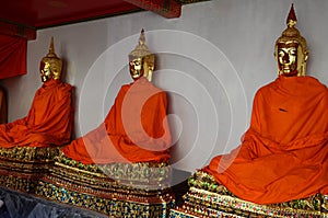 Golden buddha image with yellow robe