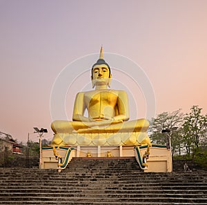 Golden Buddha overlooking Pakse at Wat Phousalao. Laos photo