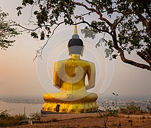 Golden Buddha overlooking Pakse at Wat Phousalao. Laos photo