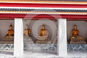 Golden Buddha sculptures in Wat Pho, Bangkok, Thailand