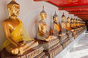 Golden Buddha sculptures in Wat Pho, Bangkok, Thailand