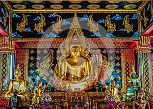 Golden Buddha seated in Buddhist Temple in Chiang Mai Thailand