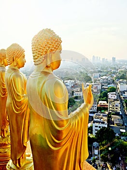 Golden Buddha with the see the world's posture photo