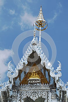 Golden Buddha on silver church