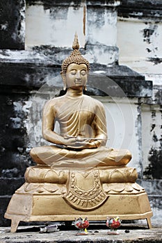 Golden buddha statue in ancient city