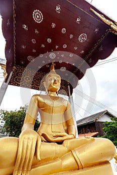 Golden Buddha statue close up, tradition and religion in Southeast Asia, travel concept