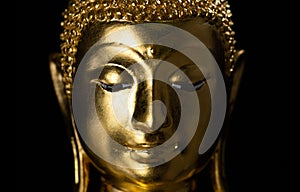 Golden buddha statue closeup portrait