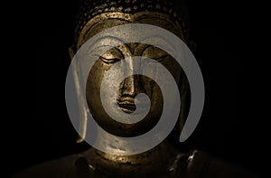 Golden buddha statue closeup portrait