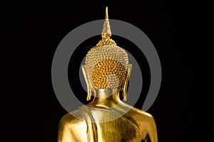Golden buddha statue closeup portraitbehind