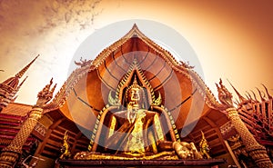 Golden Buddha statue decorated with mosaic inside the semi-circular dome named `Chin Prathanporn` situated in outdoor area of Wat