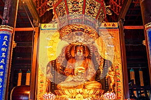 Golden buddha statue in Fayu Temple. Mount Putuo