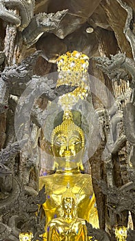 Golden Buddha Statue Inside Wat Maniwong Temple, Nakhon Nayok, Thailand â Sacred Interior Detail photo