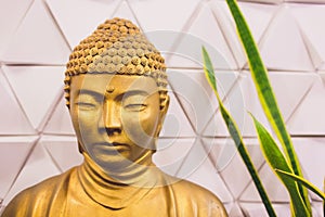 Golden buddha statue isolated on white background.